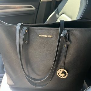 Black Michael Kors purse. Weekender style.